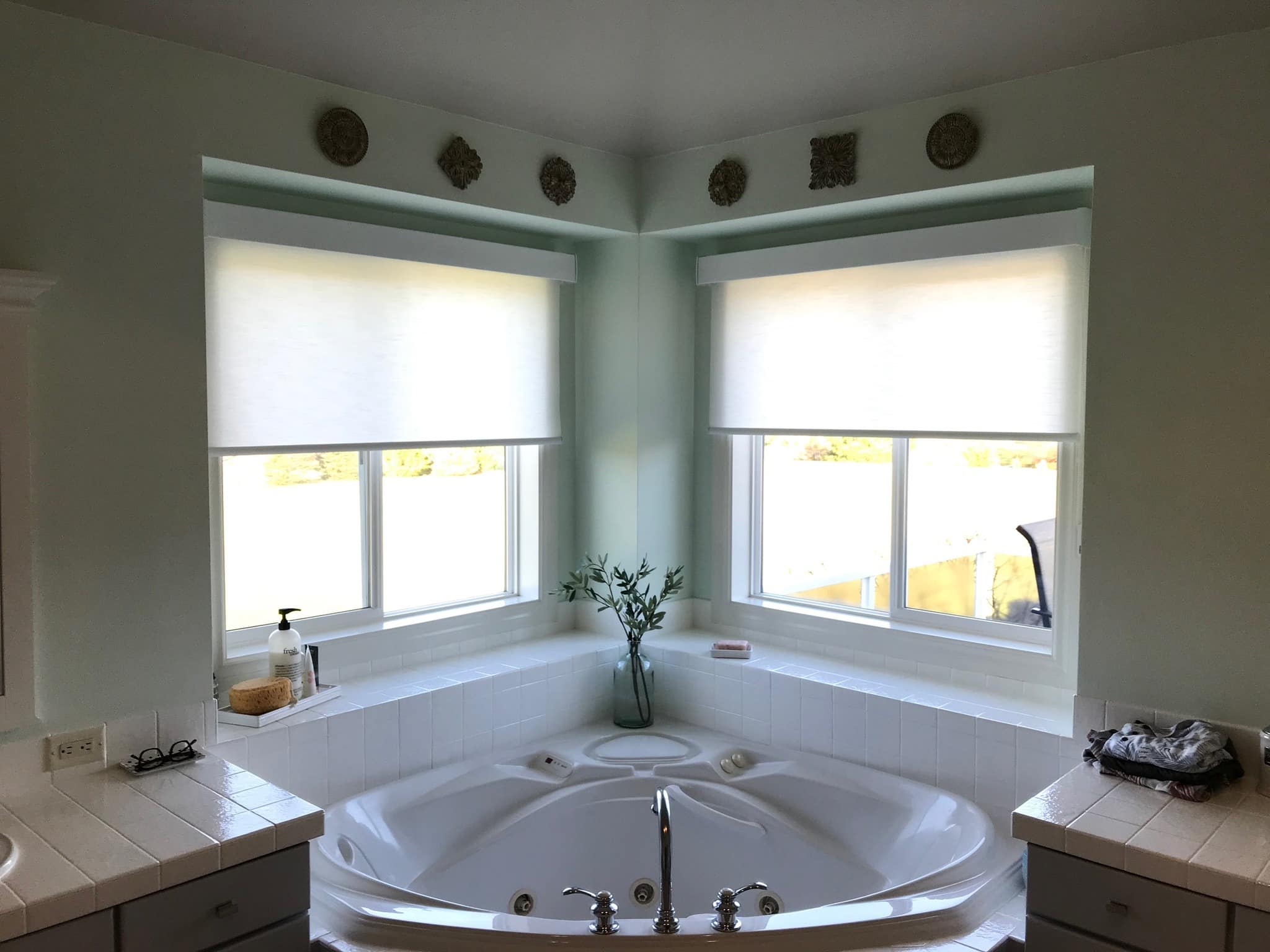 Modern bathroom with water-resistant roller blinds installed by Lorraine’s Window Coverings in Bellingham.