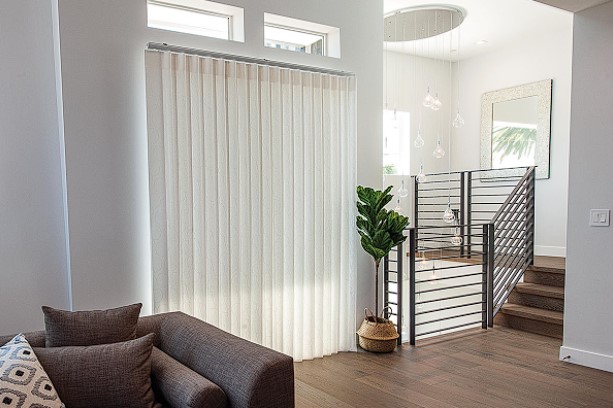 Modern home interior with roller window shades in Bellingham, WA providing privacy, light control, and energy efficiency